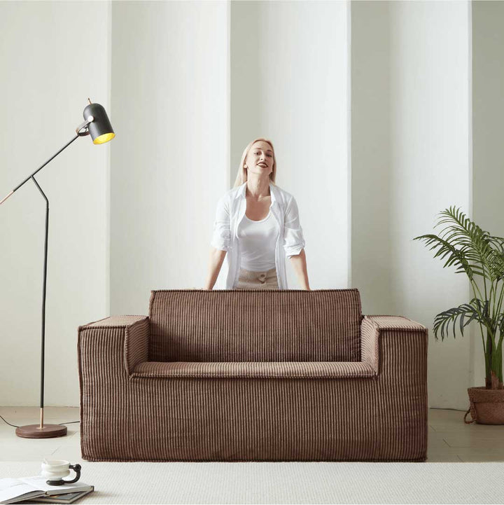 Back view of mocha brown Matoresu SignatureLux memory foam sofa with model